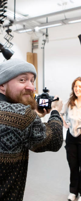 photography students talking photos in digital studio